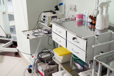 High angle view of bottles on shelf in kitchen