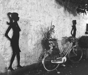 Bicycle standing against wall