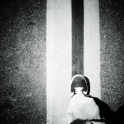 Close up of person standing on tiled floor