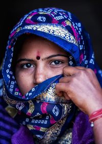 Portrait of man covering face