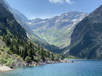 Scenic view of lake and mountains against sky