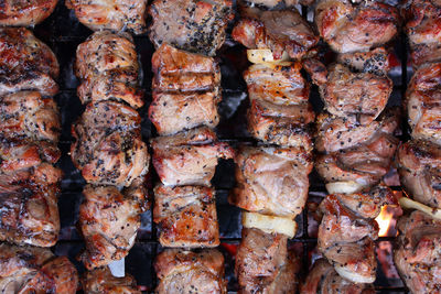 Full frame shot of meat on barbecue grill