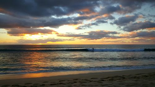 Scenic view of sea at sunset