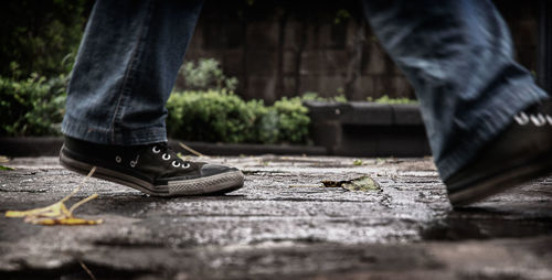 Low section of man standing on floor