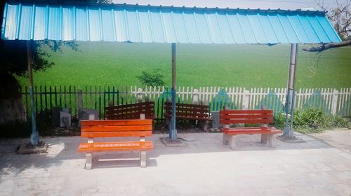 Empty bench against clear sky