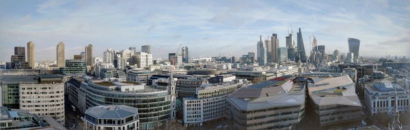 High angle view of cityscape against cloudy sky