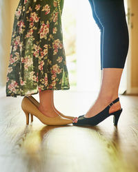 Low section of woman standing on floor