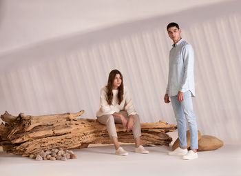 Full length of young woman standing at home