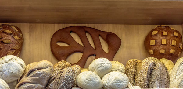 Close-up of baked breads in bakery