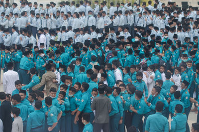 High angle view of group of people standing outdoors