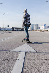 Close-up of anonymous man on longboard
