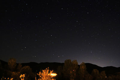 Scenic view of mountain against sky at night