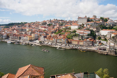 High angle view of river in city against sky