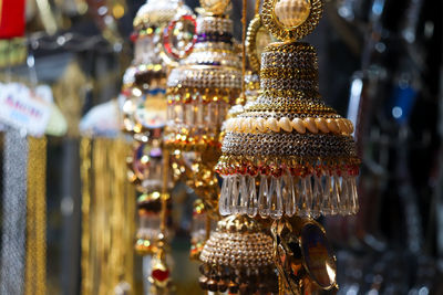 Close-up of decorations hanging in store for sale at market