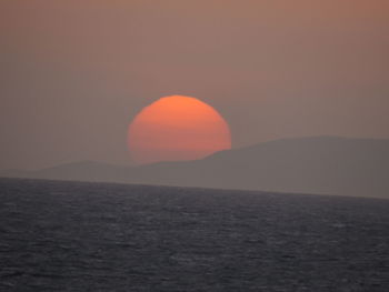 Scenic view of sea against clear sky during sunset