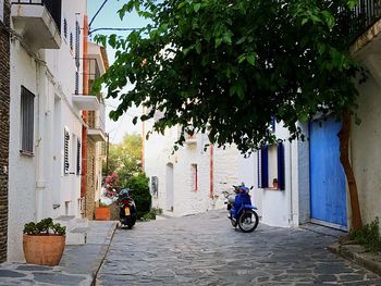 People in car against sky in city