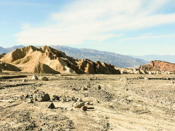 Scenic view of arid landscape against sky