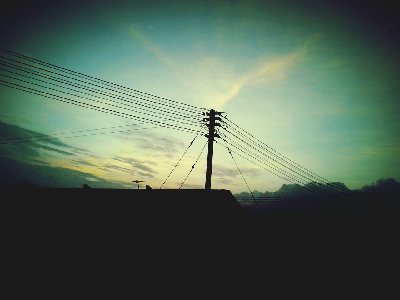 sky, silhouette, low angle view, fuel and power generation, electricity pylon, power line, electricity, cloud - sky, power supply, sunset, technology, connection, cloud, nature, outdoors, no people, dusk, cloudy, tranquility, sunlight