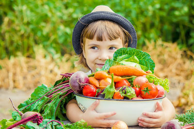 High angle view of young woman with vegetables