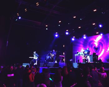 Rear view of people enjoying music concert