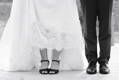 Low section of friends standing on floor