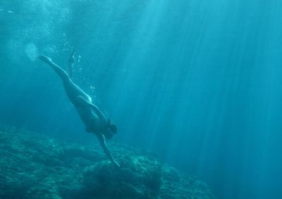 Man swimming in sea