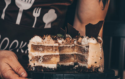 Midsection of person holding ice cream