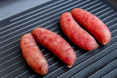 High angle view of meat on barbecue grill