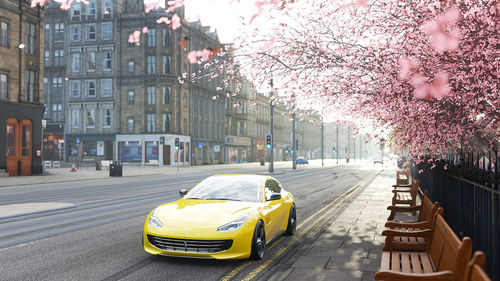 View of yellow and cars on street
