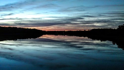 Scenic view of lake at sunset