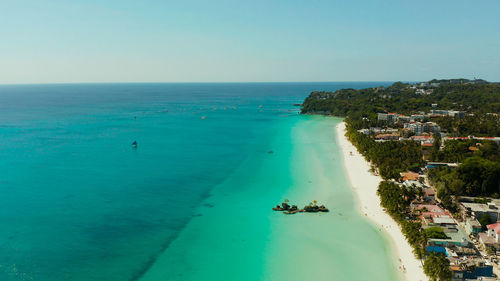 Tropical beach with tourists and clear blue sea, top view. boracay, philippines