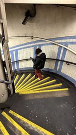 High angle view of man walking on street