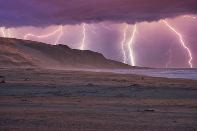 Lightning in sky over land