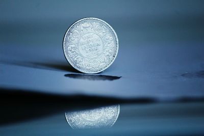 Close-up of coin on table