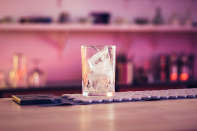 Close-up of beer glass on table