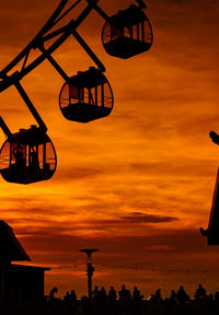 Low angle view of basketball hoop against sky during sunset