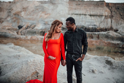 Full length of couple standing outdoors