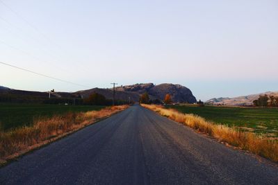 Road amidst landscape against clear sky
