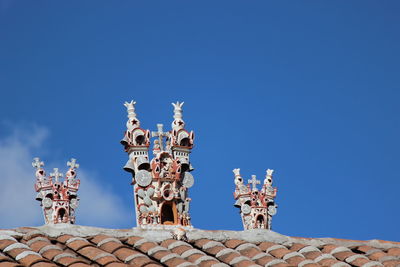 Low angle view of traditional building against blue sky