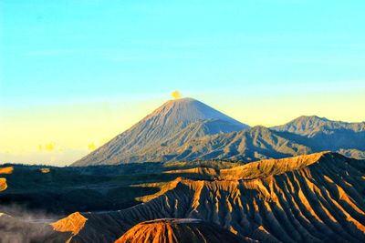 Scenic view of mountain range against sky