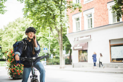 Man riding bicycle on city street