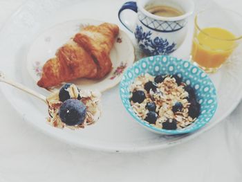 High angle view of fresh breakfast served in plate on table