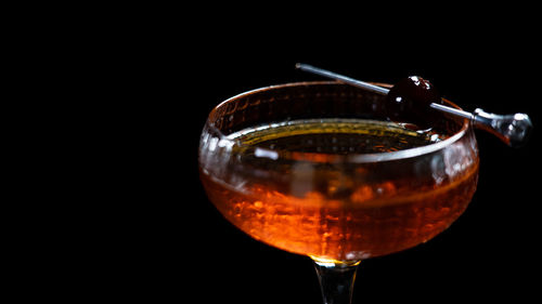 Cocktail in the bar on a black background