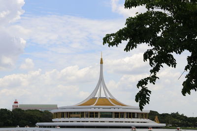 Low angle view of building against cloudy sky