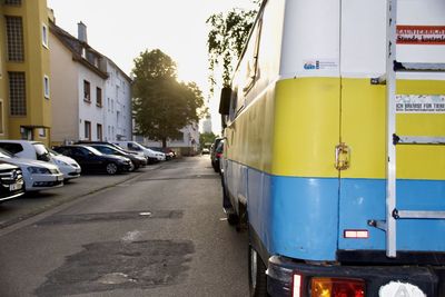 Rear view of an unimog hentschel vintage campervan with ukrainian flag painted on the body