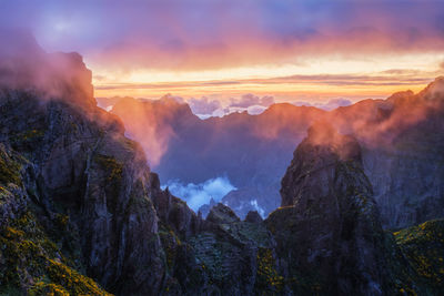 Scenic view of mountains against sky during sunset