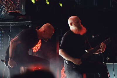 Man playing guitar at music concert