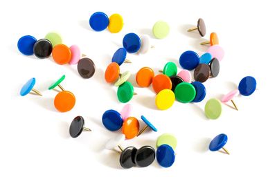 Close-up of colored pencils over white background