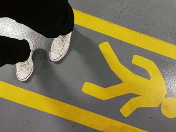 Low section of shoes on road