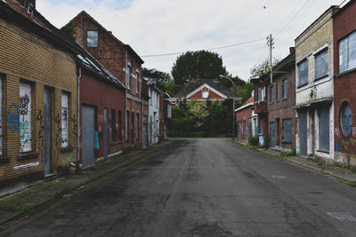 Street amidst buildings against sky